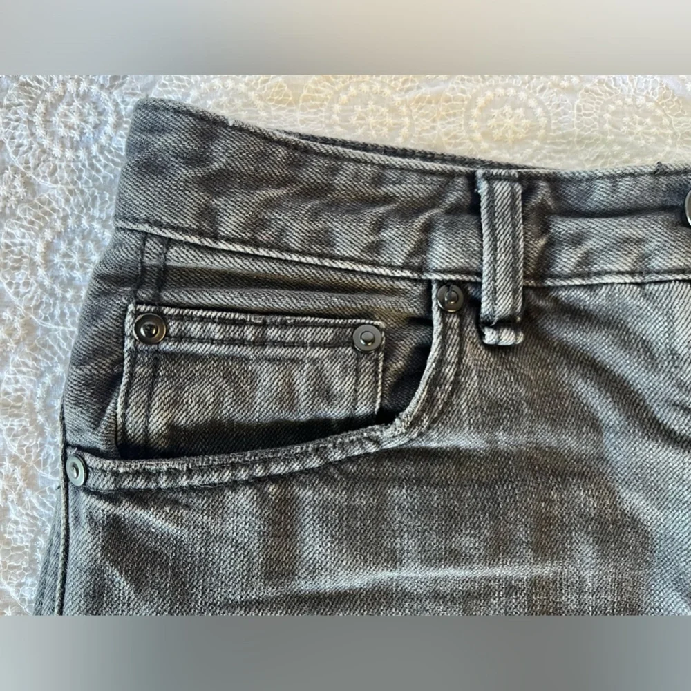 Free People black cut-off shorts, size 25; distressed black denim with raw hem